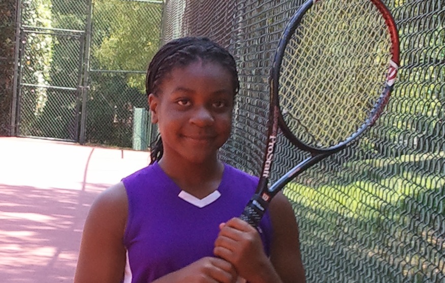 Girl with tennis racquet